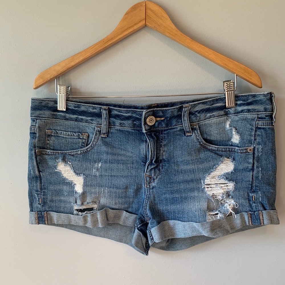 Distressed denim shorts with cuffs